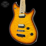 Electric guitar with a sunburst finish on a black background, featuring the Tone Shop logo.