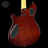 Glossy red electric guitar body with visible brand logo on a black background
