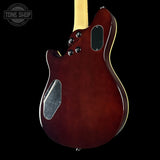 Glossy red electric guitar on a black background with 'Tone Shop' logo.
