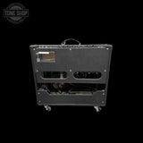 Guitar amplifier back panel with visible branding on a black background