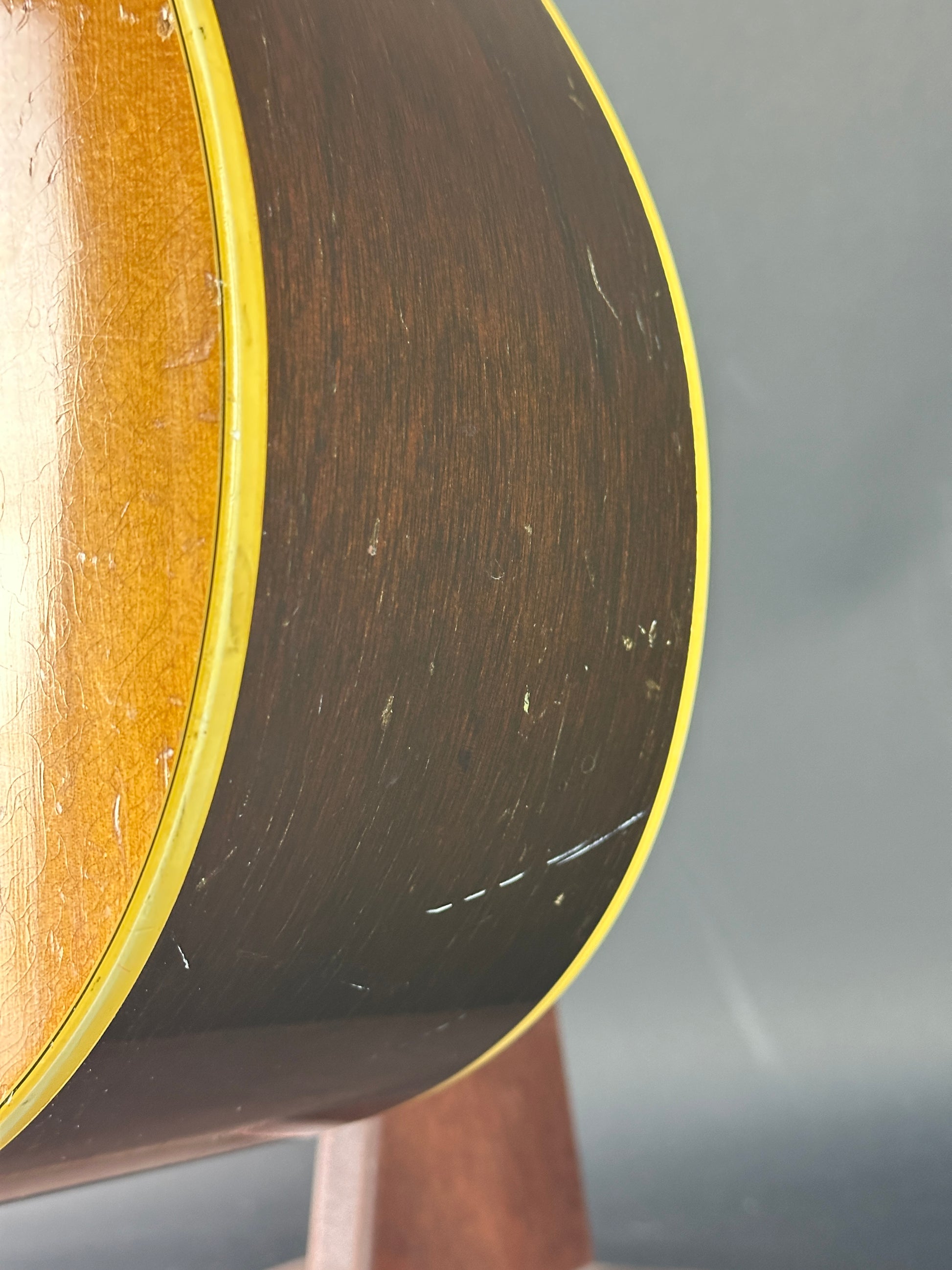 Close-up of a guitar's soundhole with a blurred background
