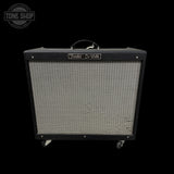 Fender De Ville guitar amplifier on a black background with 'Tone Shop' logo.