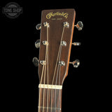 Guitar headstock with 'Martin & Co' logo on a black background