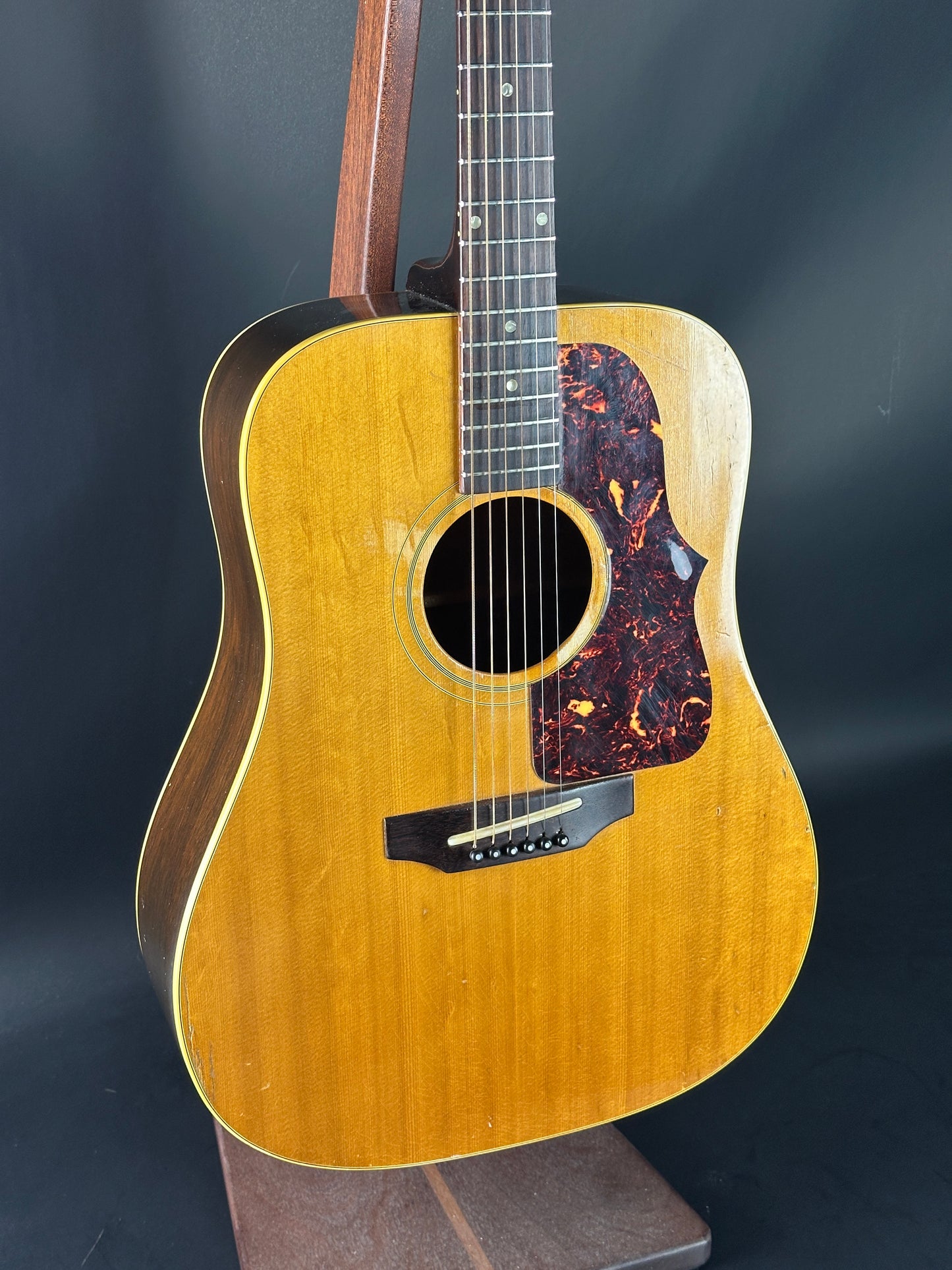 Acoustic guitar with a dark background