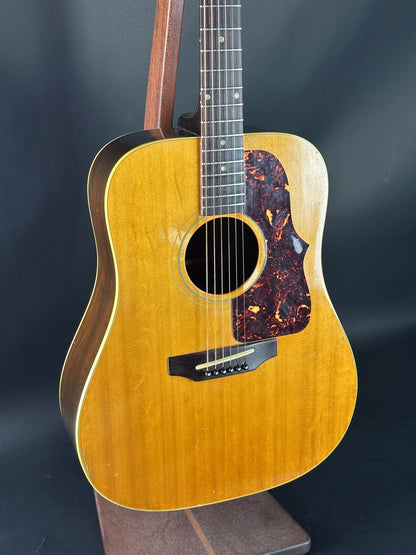 Acoustic guitar with a dark background