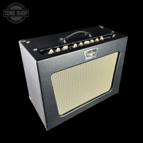 Vintage-style guitar amplifier with a brand logo on a black background