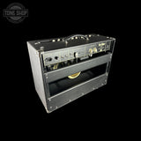 Vintage-style guitar amplifier with 'Tone Shop' branding on a black background