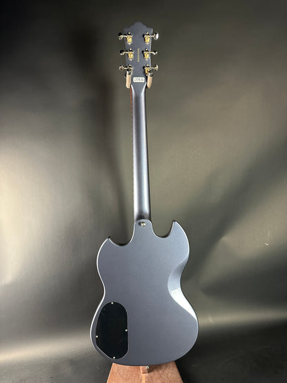 Silver electric guitar on a reflective surface