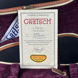 Gretsch Certificate of Authenticity on a purple guitar case