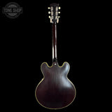 Guitar back view with 'Tone Shop' logo in the corner