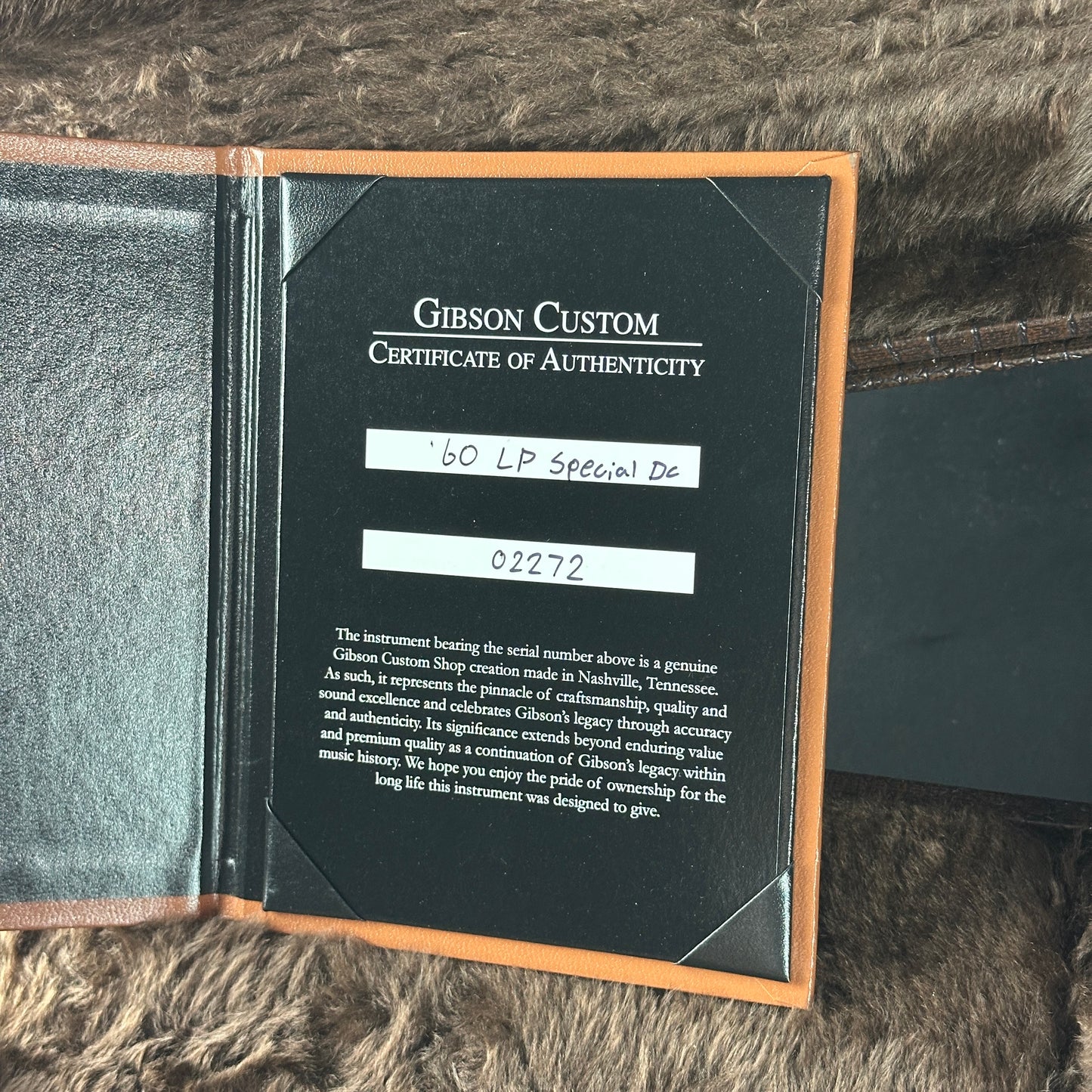 Gibson Custom Certificate of Authenticity on a textured surface