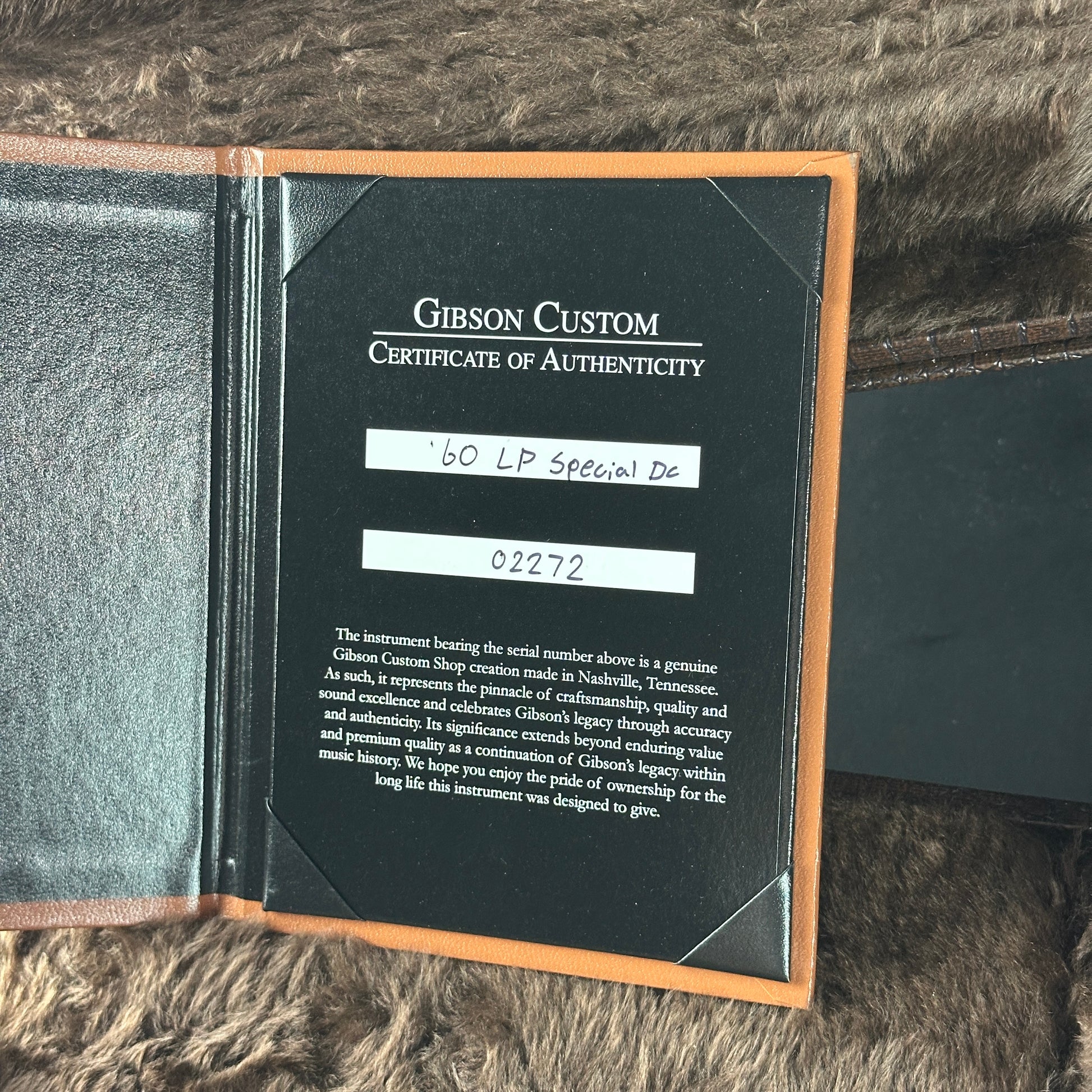 Gibson Custom Certificate of Authenticity on a textured surface