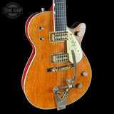 Electric guitar with a sunburst finish on a black background, featuring the Tone Shop logo.