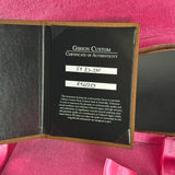 Gibson Custom Certificate of Authenticity on a pink background