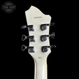 Close-up of a white guitar headstock with tuning pegs on a black background, featuring 'Tone Shop' branding.