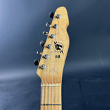 Guitar headstock with a brand logo on a dark blue background