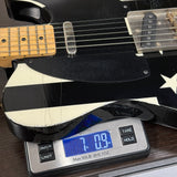 Electric guitar on a digital scale with a Texas flag in the background