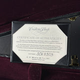 Certificate of Authenticity for a C.F. Martin guitar inside a guitar case.