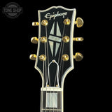 Epiphone guitar headstock with brand logo on a black background