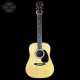 Acoustic guitar on a black background with 'Tone Shop' logo.