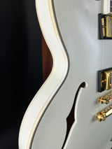 Close-up of a guitar's body with a focus on the neck joint and hardware.