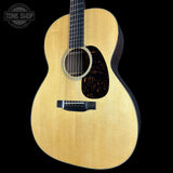 Acoustic guitar with a visible brand logo in the corner
