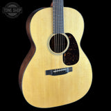 Acoustic guitar with a visible brand logo in the corner