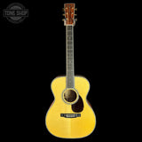 Yellow acoustic guitar on a black background with 'Tone Shop' logo.