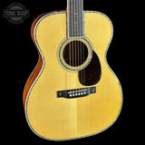 Acoustic guitar with a visible brand logo in the corner