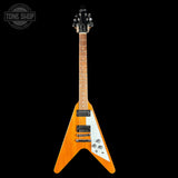 Orange electric guitar with a white pickguard on a black background, featuring 'Tone Shop' logo.