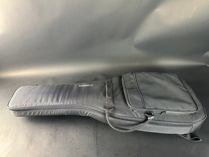 Gray guitar case on a reflective surface