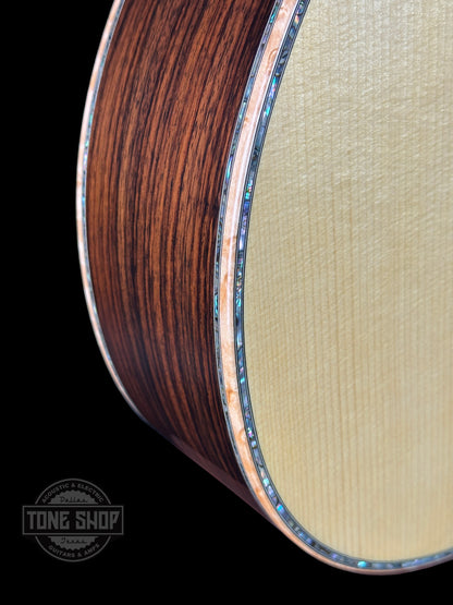 Front angle of Martin Custom Shop 00-12F 45 Style Adirondack/Wild Grain East Indian Rosewood.