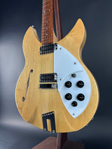 Electric guitar with a blonde finish on a dark background