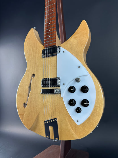 Electric guitar with a blonde finish on a dark background