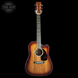 A cutaway acoustic guitar with a natural wood body and a dark fretboard, shown against a solid black background. A Tone Shop watermark is visible in the top-left corner.