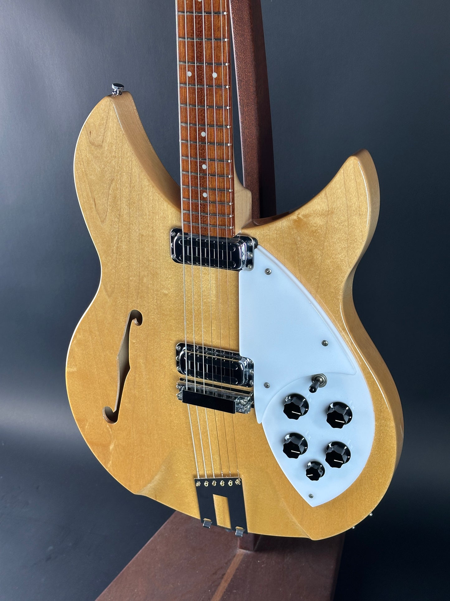 Electric guitar with a blonde finish on a dark background