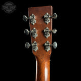 Guitar headstock with tuning pegs on a black background, featuring 'Tone Shop' logo.