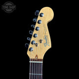 Fender Stratocaster guitar headstock on a black background