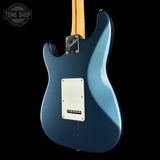 Blue electric guitar with a visible brand logo on a black background
