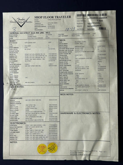Technical document or manual with text and diagrams on a reflective surface