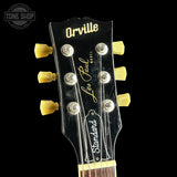 Guitar headstock with 'Orville' branding on a black background