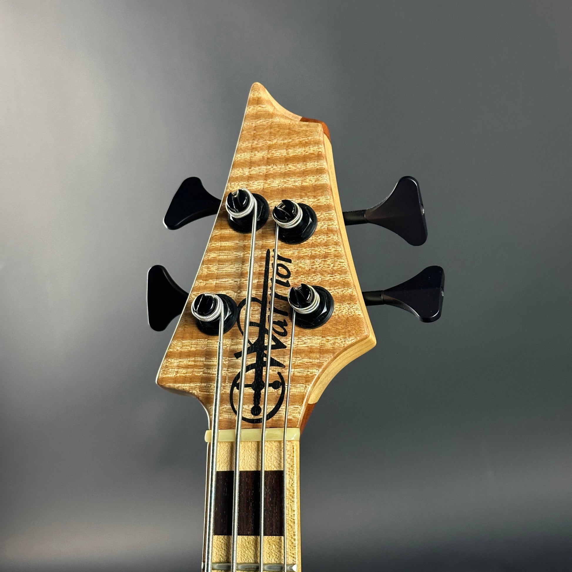 Headstock of Used 2022 Warrior 4 String Neck Thru Dran Michael.