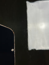 Close-up of a smartphone screen with a small drop on the corner