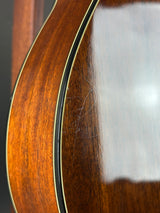 Close-up of a guitar's wooden neck and fretboard