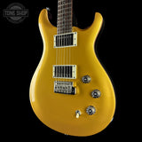 Yellow electric guitar on a black background with 'Tone Shop' logo.