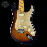 Electric guitar with a sunburst finish on a black background, featuring the Tone Shop logo.
