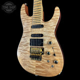 Electric guitar with a wood finish on a black background, featuring the Tone Shop logo.