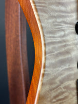 Close-up of a guitar's wooden soundboard and neck