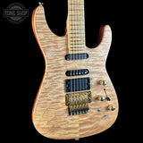 Wooden electric guitar with a visible brand logo in the corner