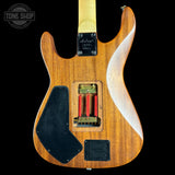 Wooden electric guitar with visible electronics on a black background, featuring the Tone Shop logo.